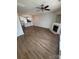 Open-concept living space showcasing modern flooring, fireplace, and a seamless flow into the kitchen at 4151 Town Center Rd, Harrisburg, NC 28075