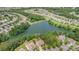 Aerial view of the community featuring a pond surrounded by lush greenery and single-Gathering homes at 4208 Rosy Billed Ct # 30, Fort Mill, SC 29707