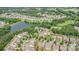 Aerial view of the community featuring a pond, golf course, and single-Gathering homes at 4208 Rosy Billed Ct # 30, Fort Mill, SC 29707