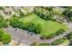 Aerial view of neighborhood park featuring green space, mature trees, and parking at 4208 Rosy Billed Ct # 30, Fort Mill, SC 29707