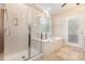 Bright bathroom featuring a walk-in shower, soaking tub, window, and access to the backyard at 4208 Rosy Billed Ct # 30, Fort Mill, SC 29707