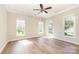 Bright bedroom with hardwood floors and three windows offering lots of natural light at 4208 Rosy Billed Ct # 30, Fort Mill, SC 29707