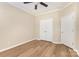 Empty bedroom featuring hardwood floors and white doors with plenty of natural light from the window at 4208 Rosy Billed Ct # 30, Fort Mill, SC 29707
