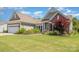 Charming single-story home with well-manicured lawn, flowerbeds, and attached two-car garage at 4208 Rosy Billed Ct # 30, Fort Mill, SC 29707