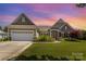 Charming single-story home with well-manicured lawn, flowerbeds, and attached two-car garage at 4208 Rosy Billed Ct # 30, Fort Mill, SC 29707
