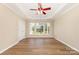 Bright living room with hardwood floors, crown molding, and large windows at 4208 Rosy Billed Ct # 30, Fort Mill, SC 29707
