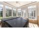 Bright sunroom featuring many windows, a ceiling fan, and a hot tub, offering a relaxing retreat at 4208 Rosy Billed Ct # 30, Fort Mill, SC 29707
