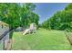The backyard features a playhouse with a slide for your  at 426 Valley St, Stanley, NC 28164