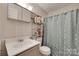 Bathroom featuring a light gray vanity and framed mirror at 426 Valley St, Stanley, NC 28164
