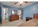 Spacious bedroom with wood floors, dresser, and connected bathroom at 426 Valley St, Stanley, NC 28164
