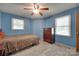 Serene bedroom with light blue walls, hardwood floors, and natural light at 426 Valley St, Stanley, NC 28164