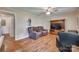 Cozy living room with hardwood floors, ceiling fan, and comfortable seating at 426 Valley St, Stanley, NC 28164