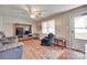 Comfortable living room featuring hardwood floors, ceiling fan, and back door at 426 Valley St, Stanley, NC 28164