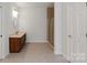 Bathroom featuring a modern vanity, glass-enclosed shower, and neutral tile flooring at 441 Vermilion Dr, York, SC 29745