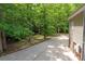 Long driveway leading to a home surrounded by mature trees at 441 Vermilion Dr, York, SC 29745