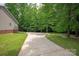 Long winding driveway leading to a home surrounded by lush trees and greenery at 441 Vermilion Dr, York, SC 29745