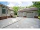 View of garage, house, concrete driveway and stairs at 441 Vermilion Dr, York, SC 29745