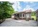Exterior shot of home showing screened porch, back door and the side of the detached garage at 441 Vermilion Dr, York, SC 29745