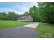 Charming home with lush landscaping, long driveway, and a welcoming covered front porch at 441 Vermilion Dr, York, SC 29745