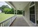 Inviting covered porch with white railings and ample space for outdoor seating at 441 Vermilion Dr, York, SC 29745