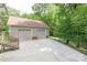 Spacious two-car garage with matching brick facade, accessible via concrete driveway and wooden stairs at 441 Vermilion Dr, York, SC 29745