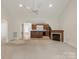 Bright living room with a fireplace, archways, and seamless flow into the adjacent kitchen at 441 Vermilion Dr, York, SC 29745