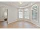 Light-filled living room has arched windows and tile flooring at 441 Vermilion Dr, York, SC 29745