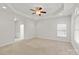 Serene main bedroom with a tray ceiling, neutral tones, and a large window at 441 Vermilion Dr, York, SC 29745