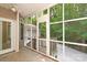 Screened porch overlooking wooded yard and detached garage at 441 Vermilion Dr, York, SC 29745