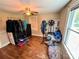 Simple bedroom with hardwood floors and a ceiling fan at 450 1St Se St, Hickory, NC 28602