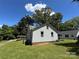 View of the side of the house with green grass and clear sky at 450 1St Se St, Hickory, NC 28602