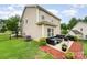 Spacious backyard featuring a patio, manicured lawn, and privacy fence at 611 Sawtooth Oak Dr, Landis, NC 28088