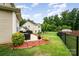 Well-maintained backyard with patio area, lush lawn, and fence at 611 Sawtooth Oak Dr, Landis, NC 28088