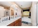 Bathroom with double sink vanity, soaking tub, walk-in shower, and neutral paint at 611 Sawtooth Oak Dr, Landis, NC 28088