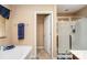 Bathroom featuring walk-in shower, soaking tub and neutral walls at 611 Sawtooth Oak Dr, Landis, NC 28088