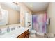 Bathroom featuring colorful shower curtain, white toilet, wood vanity, and carpeted floors at 611 Sawtooth Oak Dr, Landis, NC 28088