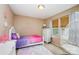 Cozy bedroom featuring natural light, neutral walls, and carpeted floors at 611 Sawtooth Oak Dr, Landis, NC 28088