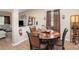 Dining area features wood flooring and a charming table set for four at 611 Sawtooth Oak Dr, Landis, NC 28088