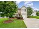 Charming two-story home with manicured lawn and inviting curb appeal at 611 Sawtooth Oak Dr, Landis, NC 28088