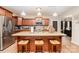 Kitchen island with granite countertops and seating in an open concept layout at 611 Sawtooth Oak Dr, Landis, NC 28088