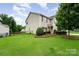 Well-maintained lawn with partial fence on a charming two-story home at 611 Sawtooth Oak Dr, Landis, NC 28088
