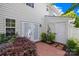 Enclosed back yard with garden, patio, and access doors offers private outdoor living and easy indoor-outdoor flow at 6128 Warrior Ave, Fort Mill, SC 29707