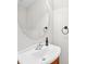 This half bathroom features a modern sink and vanity with a stylish round mirror at 6128 Warrior Ave, Fort Mill, SC 29707