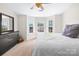 Inviting bedroom with a ceiling fan, large windows and a comfortable bed at 6128 Warrior Ave, Fort Mill, SC 29707