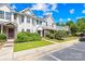Well-maintained townhomes with charming exteriors and vibrant green spaces creating a welcoming neighborhood at 6128 Warrior Ave, Fort Mill, SC 29707