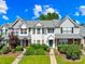 Charming townhome with well-manicured lawn and colorful landscaping, offering inviting curb appeal at 6128 Warrior Ave, Fort Mill, SC 29707