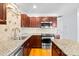 Bright kitchen boasts granite countertops, stainless steel appliances, and ample cabinet space at 6128 Warrior Ave, Fort Mill, SC 29707