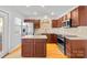 Modern kitchen with stainless steel appliances, granite counters, and ample cabinet space at 6128 Warrior Ave, Fort Mill, SC 29707