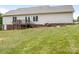 A vast backyard features a deck, patio, mature landscaping, and room for recreation at 7006 Lone Eagle Dr # 18, Monroe, NC 28110
