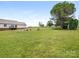 Expansive backyard with firepit area, mature trees, and views of the home at 7006 Lone Eagle Dr # 18, Monroe, NC 28110